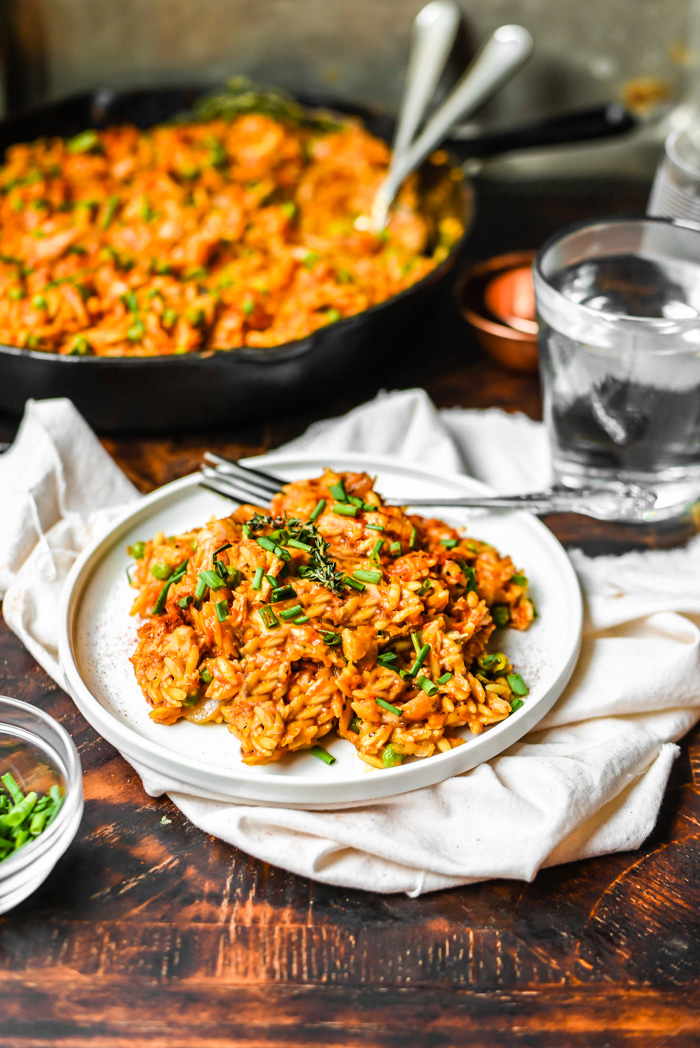 vegan roasted red pepper orzo with peppers and onions